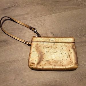 EUC Metallic gold Coach brand hand wristlet